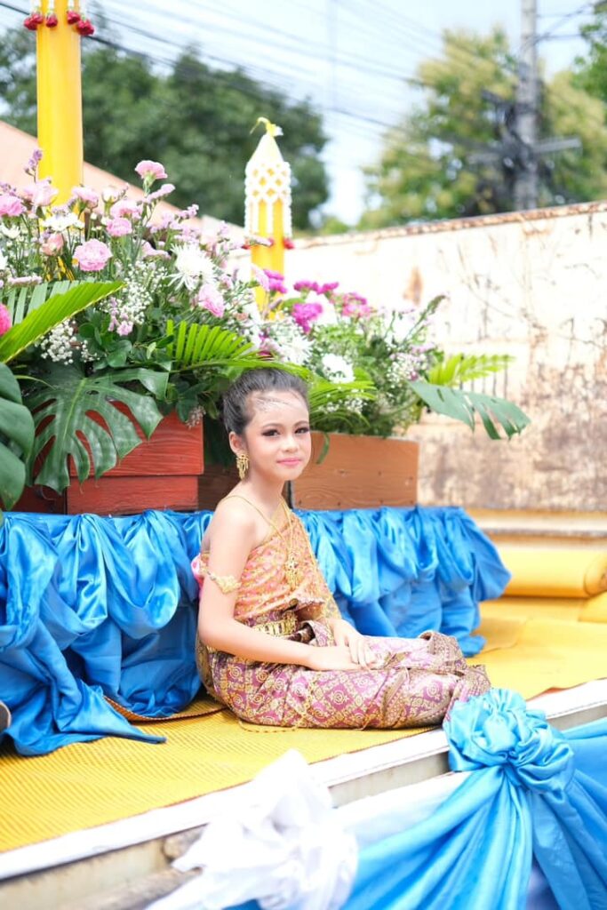 May be an image of 1 person, flower and temple